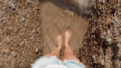 Top-view,-woman-or-feet-by-beach