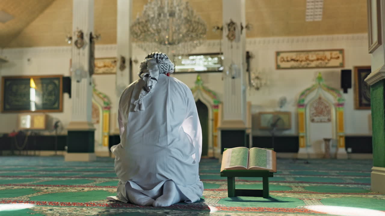 Muslim man praying in a mosque