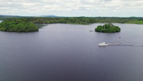 aerial view of a yacht on lough key with mcdermott's castle in the background