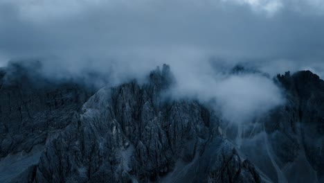 aerial drone footage of moody mountains in the dolomites