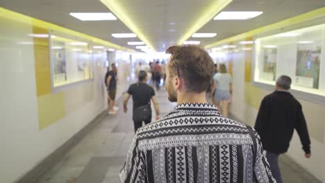 The-young-man-passing-through-the-underpass.