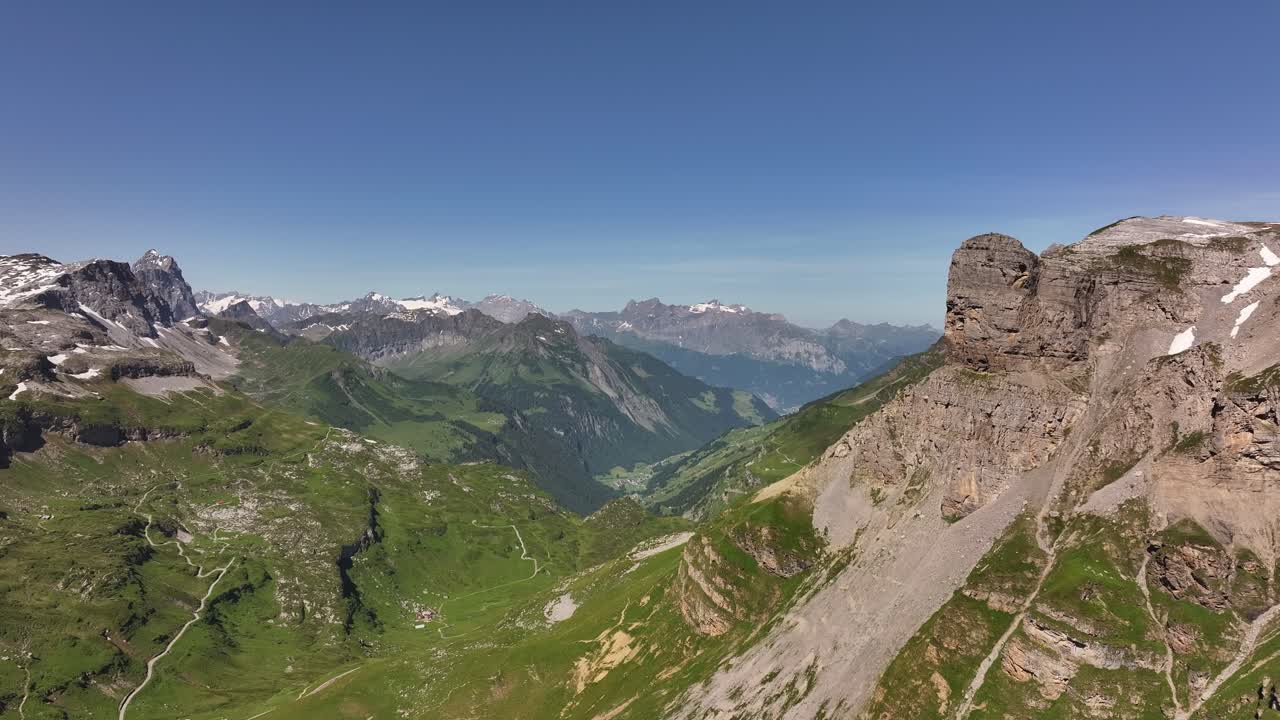 Aerial view advancing over Fisetenpass and Klausenpass in the Swiss Alps