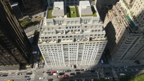 High-angle-drone-shot-circling-the-15-Central-park-west-condo,-in-sunny-NYC