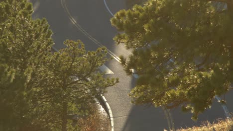 Aerial-view-of-biker-riding-in-the-mountains