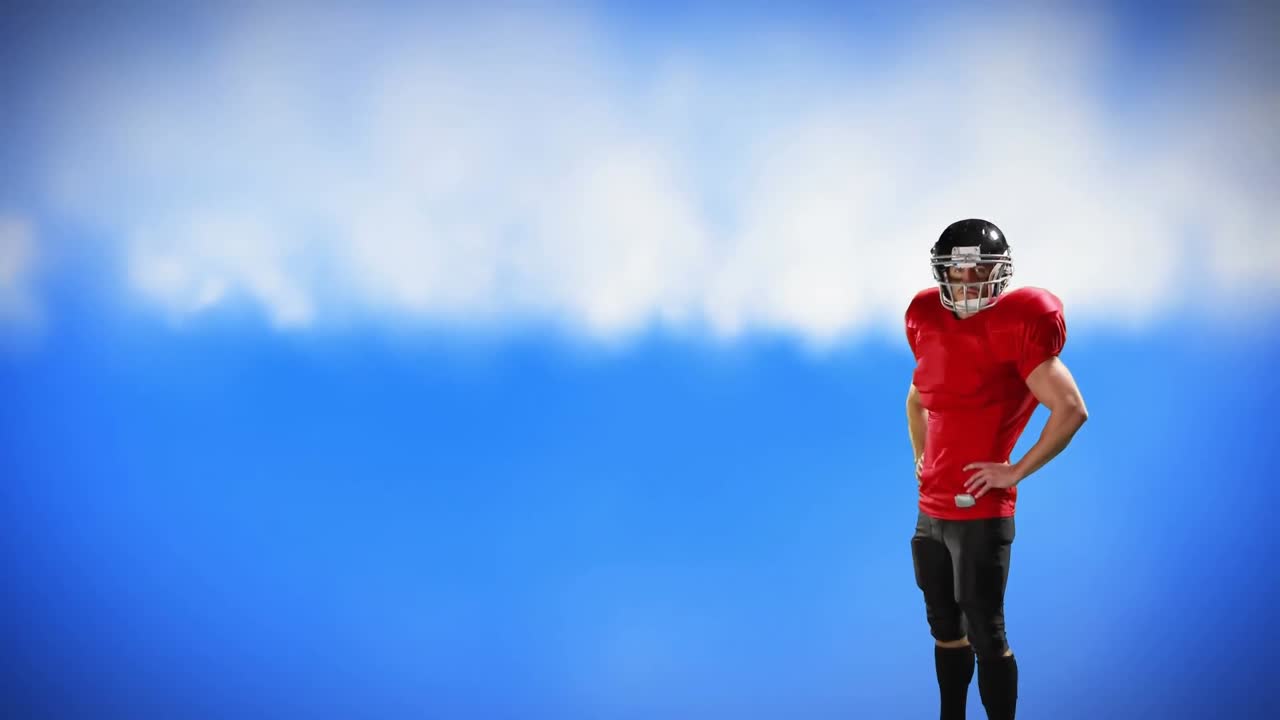 허리에 팔을  ⁇ 고 서 있는 축구 선수