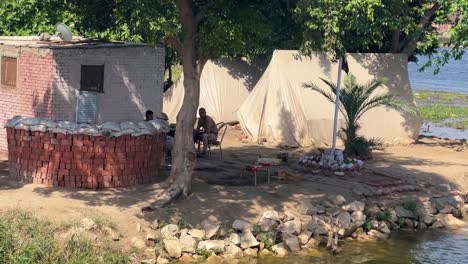 police checkpoint on nile river close to cairo in egypt during the day with fauna and vegetation in the north of africa