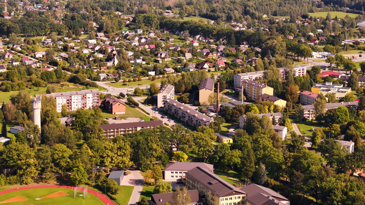 Koknese Latvian urban town with lot of trees at sunset. Aerial