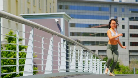 Young-femlae-dancer-practicing-dance-on-a-bridge-4k