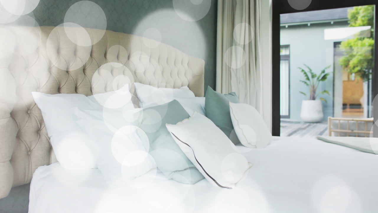 Animation of white spots over empty bedroom