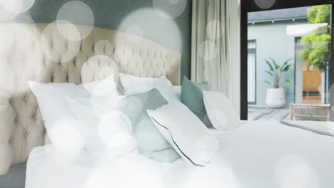 animation of white spots over empty bedroom