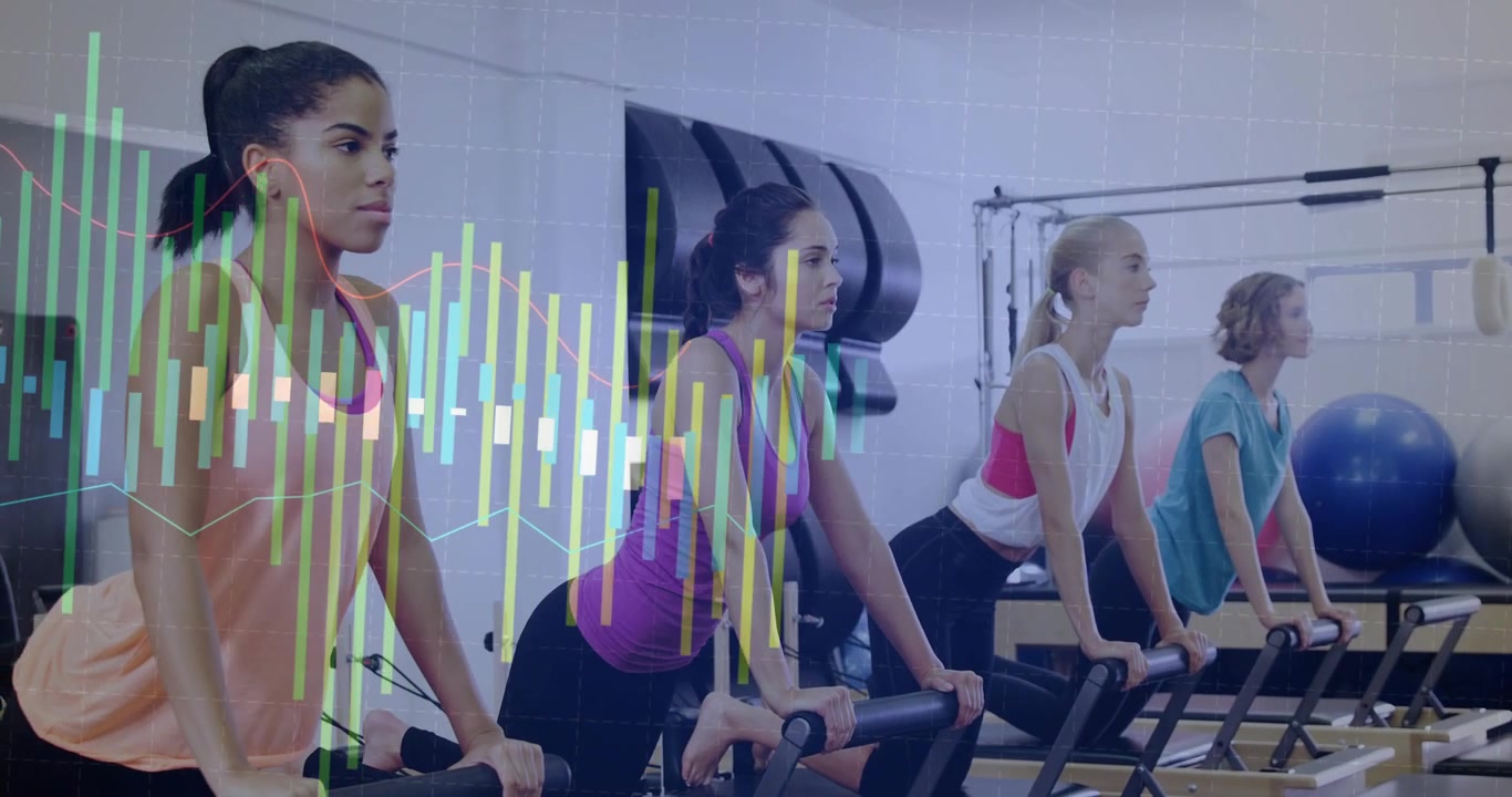 Camera panning left showing 4 women doing reformer reps for Pilates class, waveform masking center