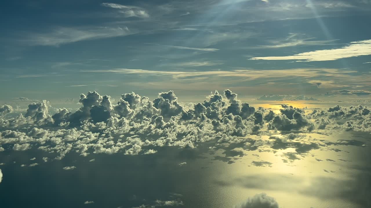 Stunning Aerial View of Clouds Over the Ocean at Sunset