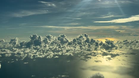stunning aerial view of clouds over the ocean at sunset
