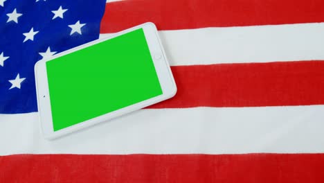 digital tablet on american flag