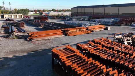 rusty steel beams and girders in manufacturing facility storage yard