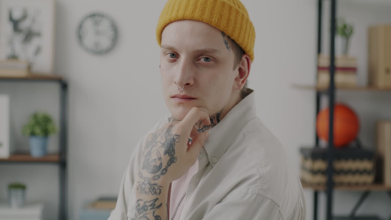 Stylish Young Man with Tattoos and Piercings