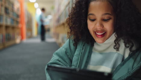 a young girl studies at the library