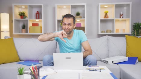 home office worker man making negative gesture at camera.