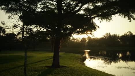 Footage-of-a-lake-with-a-fountain-during-sunrise-in-a-Florida-community