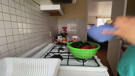 woman tidying up her kitchen in a time-lapse video