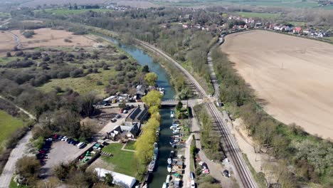 drone flies high towards a bridge