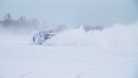 car driving through snowstorm