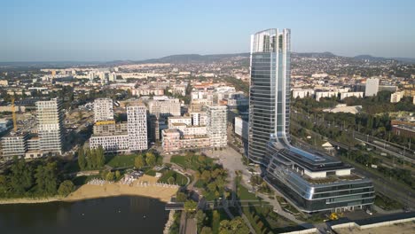 drone orbits above mol campus in budapest, hungary - beautiful day