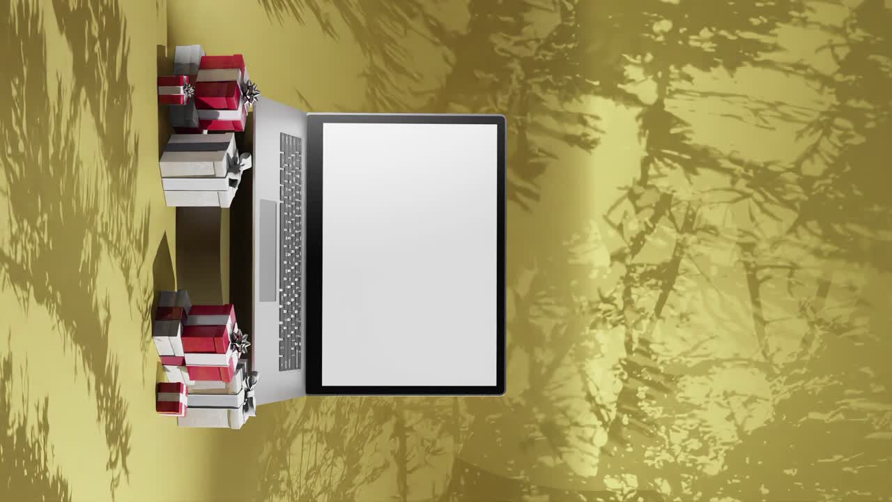 전면에 크리스마스 선물이 있는 새 노트북, 노란색 배경 수직 애니메이션