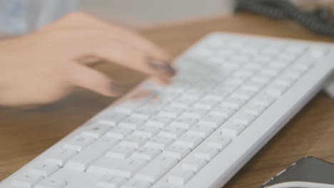 woman typing on a keyboard