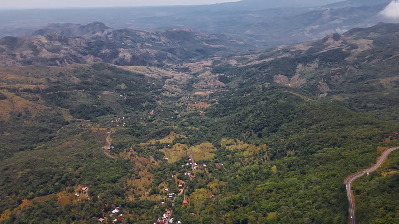 Aerial View Of Lush Mountainous Town Of Bocas del Toro With Dense Green Vegetation. panning shot