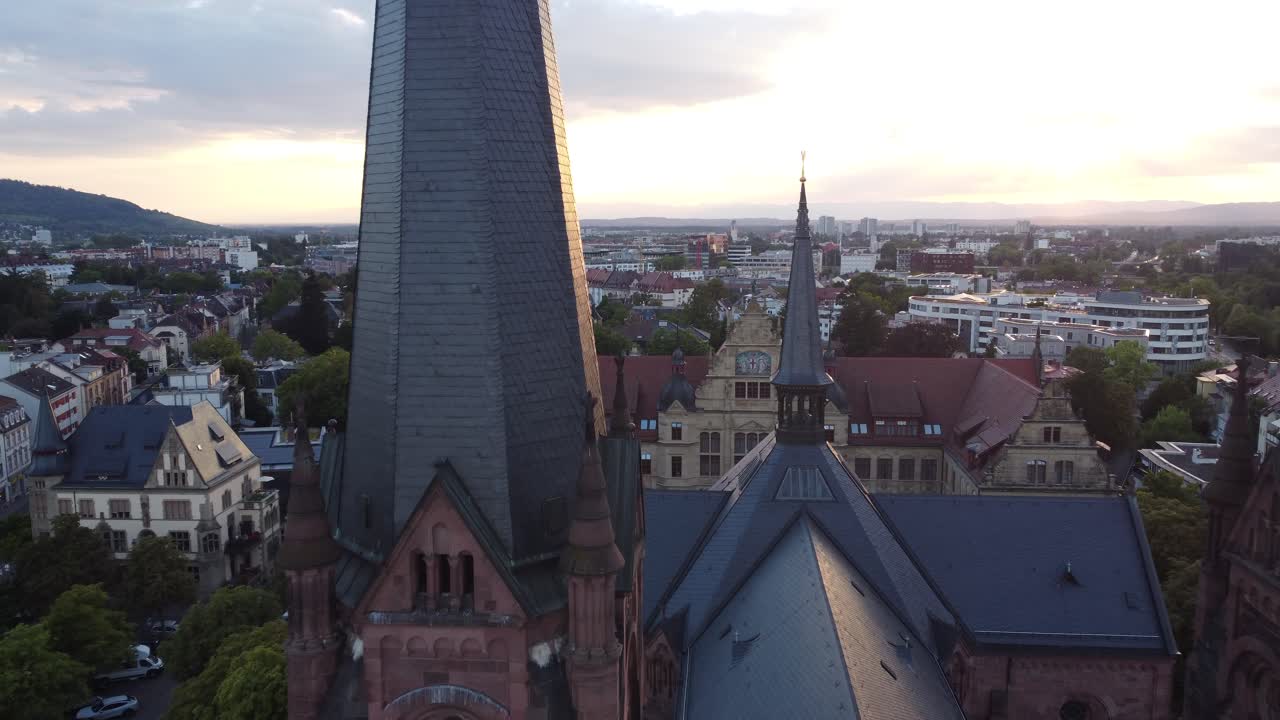 Cinematic aerial view of Freiburg im Breisgau with Catholic church and old town gothic landscape, Germany