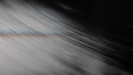 Close-up,-macro-shot-of-old-vinyl-disc-spinning-on-a-record-player