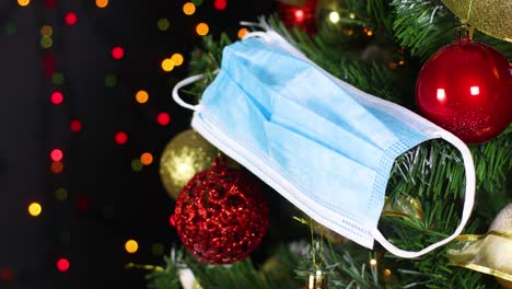 face protection mask for covid 19 on christmas tree