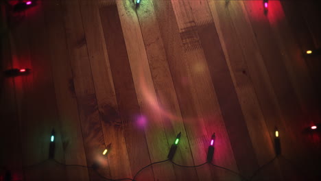 Animated closeup colorful garland on wood background