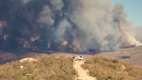 huge, tall, enormous columns of smoke rise into the sky