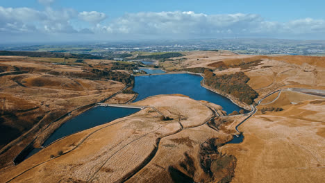 Aerial-drone,-cinematic-footage-of-a-valley-with-3-lakes-reservoirs,-piethorn,-kittcliffe-and-ogden-reservoir,-Oldham,-UK