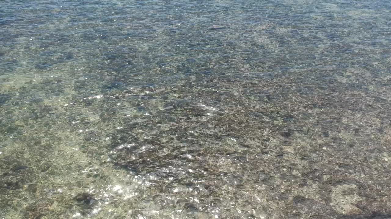 RAW drone video of the ocean and Chinaman's hat in Oahu, Hawaii