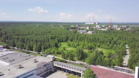 industrial complex with forest background