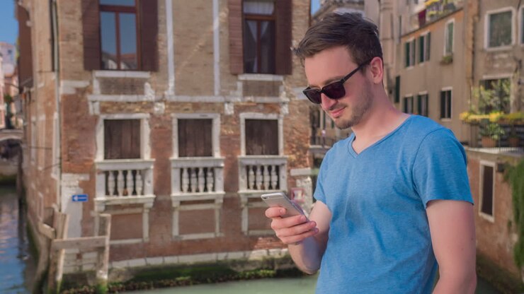 Man using phone in Venice