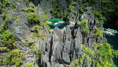 4k drone flys over sharp karst in twin lagoon, coron, palawan philippines