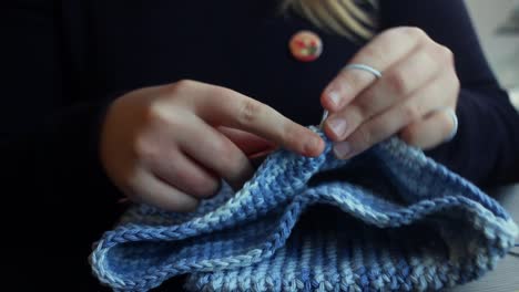 woman-knitting-with-crochet-hook