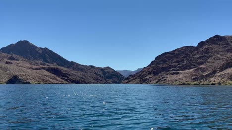 blue skys and sparkling blue waters of the colorado river along the eldorado mountains in nevada usa