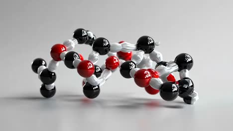 un modelo molecular de una molécula con esferas rojas y negras