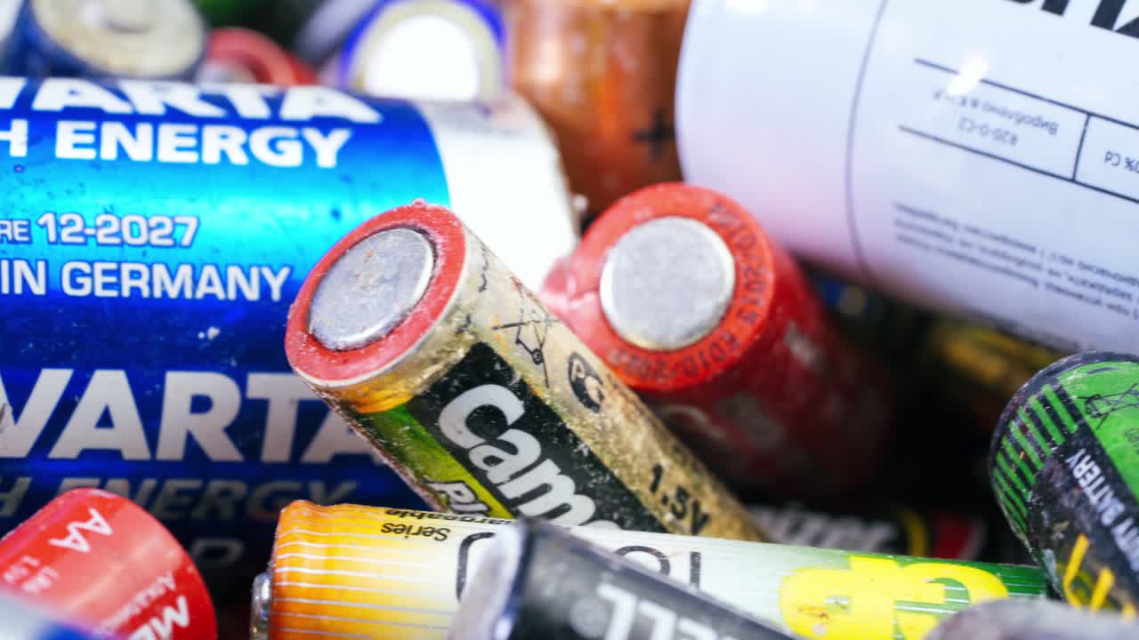collecting used batteries at the recycling station
