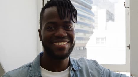 Portrait-of-a-man-at-home-smiling