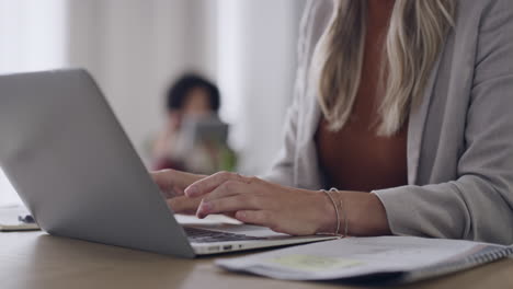 closeup of a businesswoman browsing on a laptop