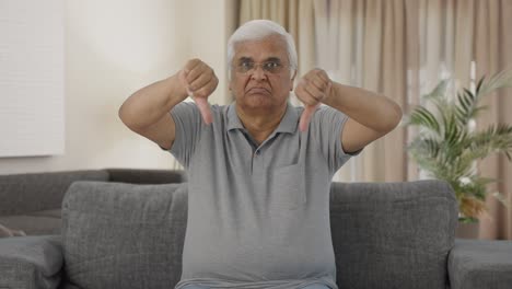 Frustrated-Indian-old-man-showing-thumbs-down