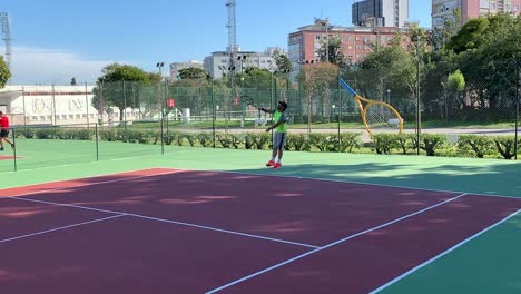 Mid-low-section-of-man-bouncing-ball-to-doing-the-server-on-tennis-court