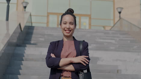 smiling businesswoman on stairs