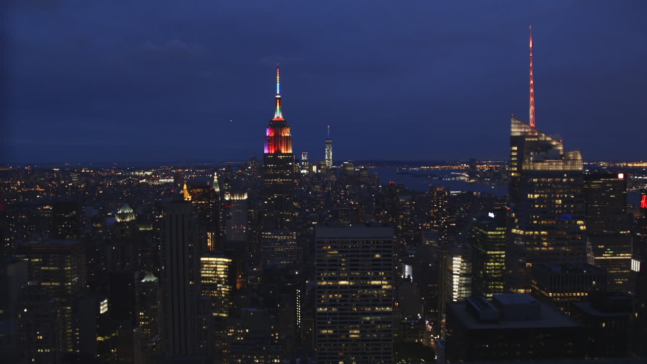 Night view of New York City skyline, featuring the Empire State Building